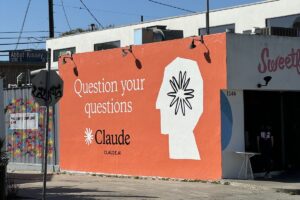 Claude ad on side of building