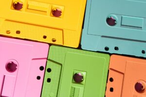 Vibrant cassette tapes in yellow, pink, green, blue, and orange